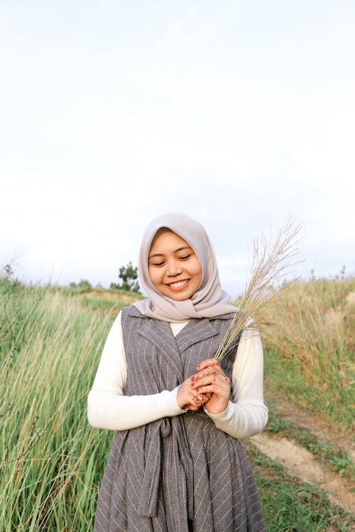 Woman Holding Wheat Grass