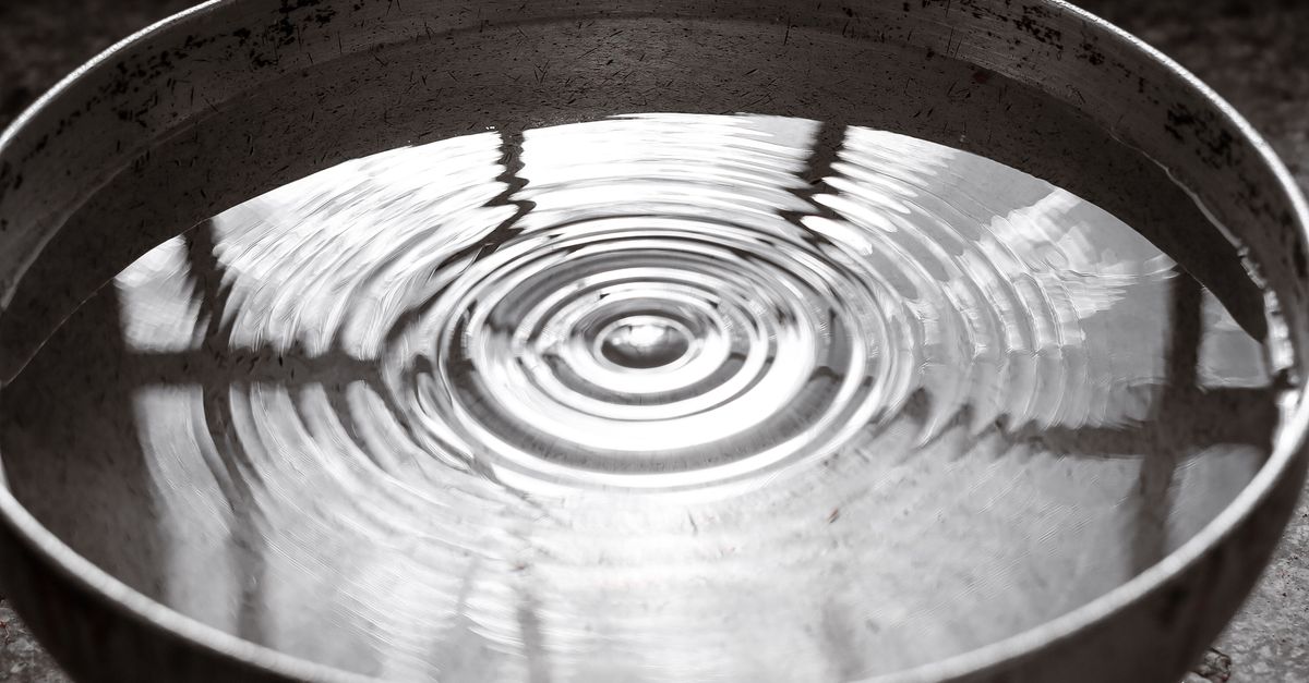 Water Ripples On Table Ripples on the Water Surface in a Steel Bowl · Free Stock Photo
