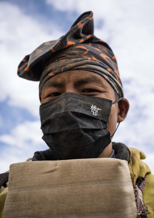 Man Posing in Mask and Hairband