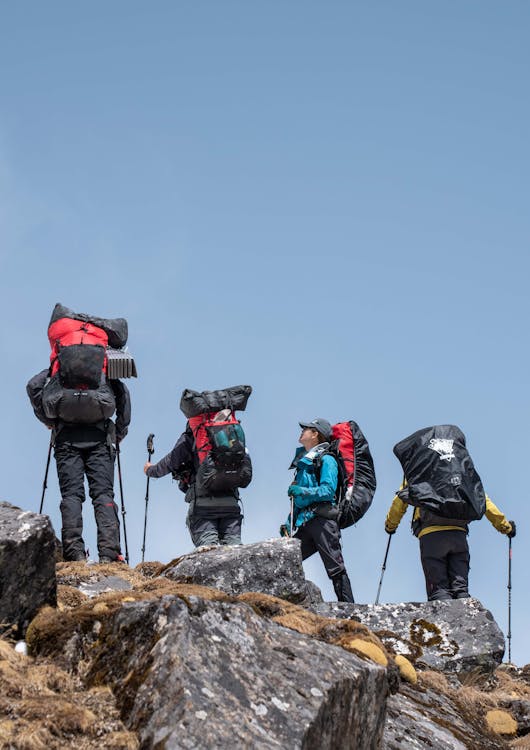 People Hiking on Rocks