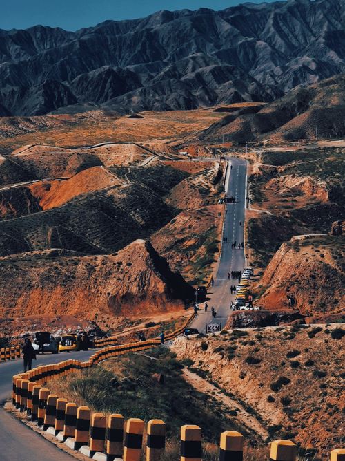 Free A winding road through arid hills under clear skies, perfect for travel imagery. Stock Photo