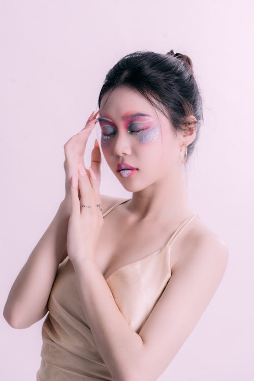 Portrait of a Female Model Wearing a Colorful Makeup