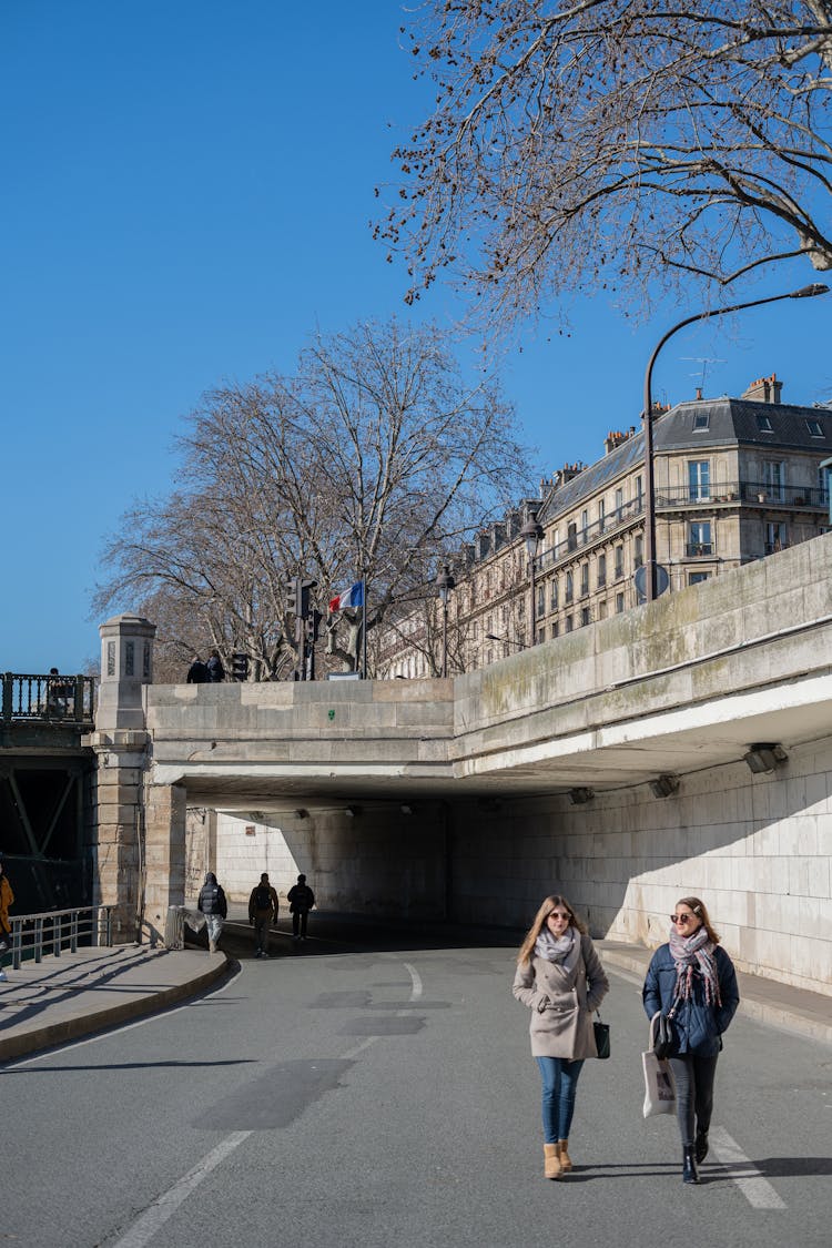 Photo Of Two Women Walking In Paris, France