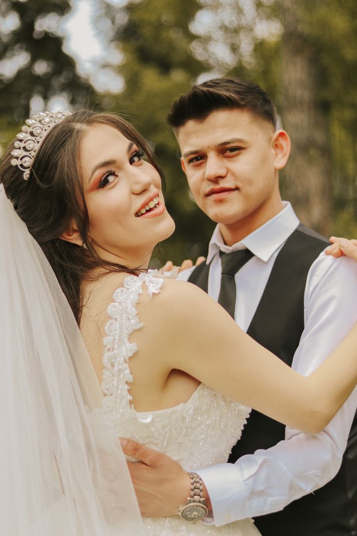 Joyful couple at a warm outdoor wedding