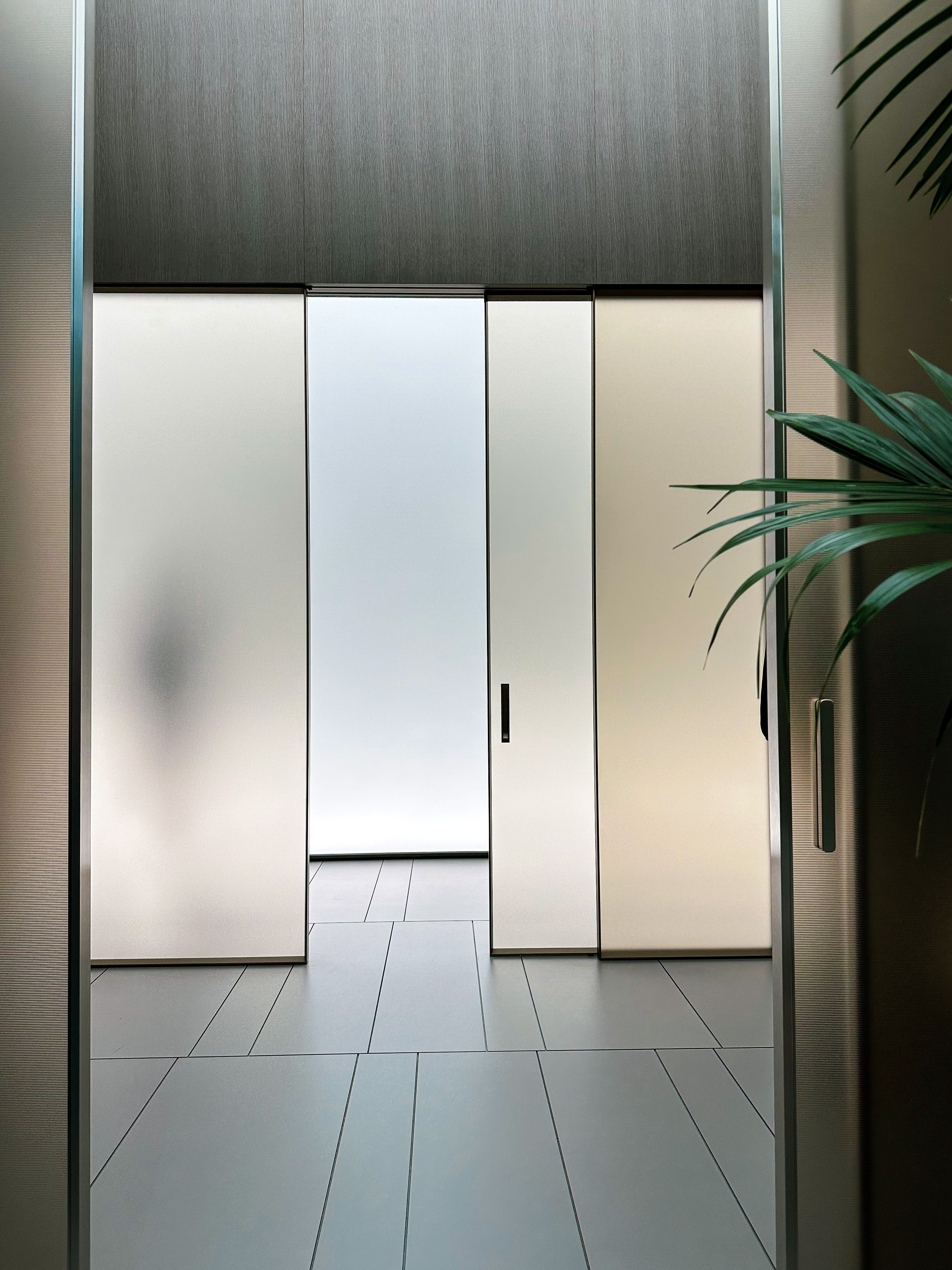 Frosted glass sliding panels closing off a room