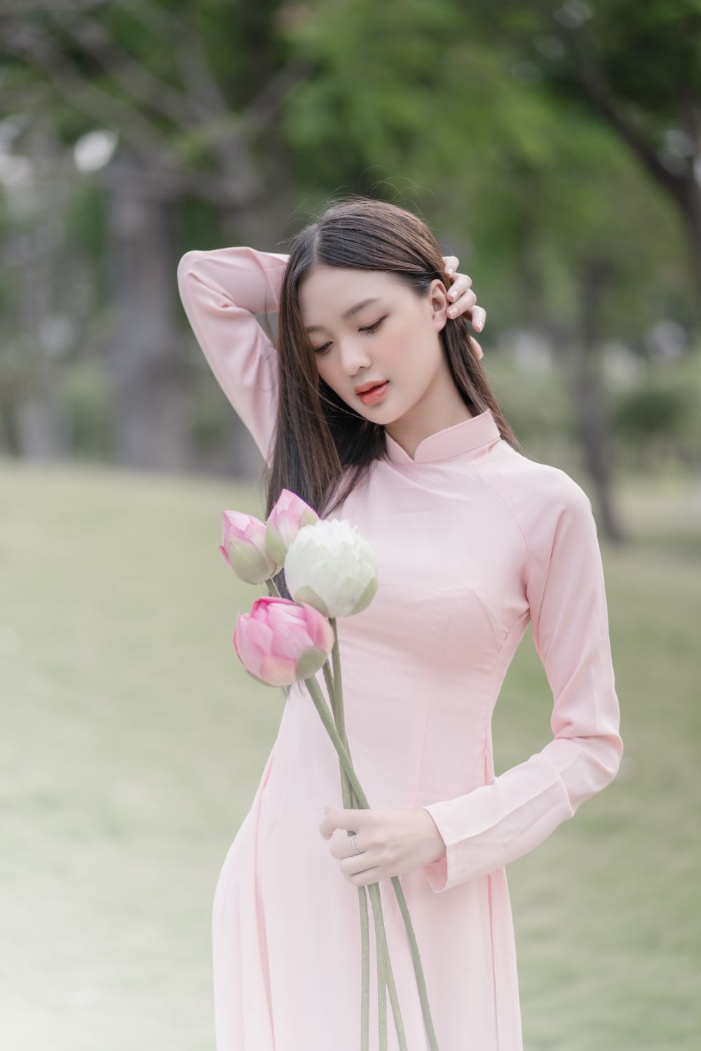 Woman in Pink Dress Posing with Flowers · Free Stock Photo