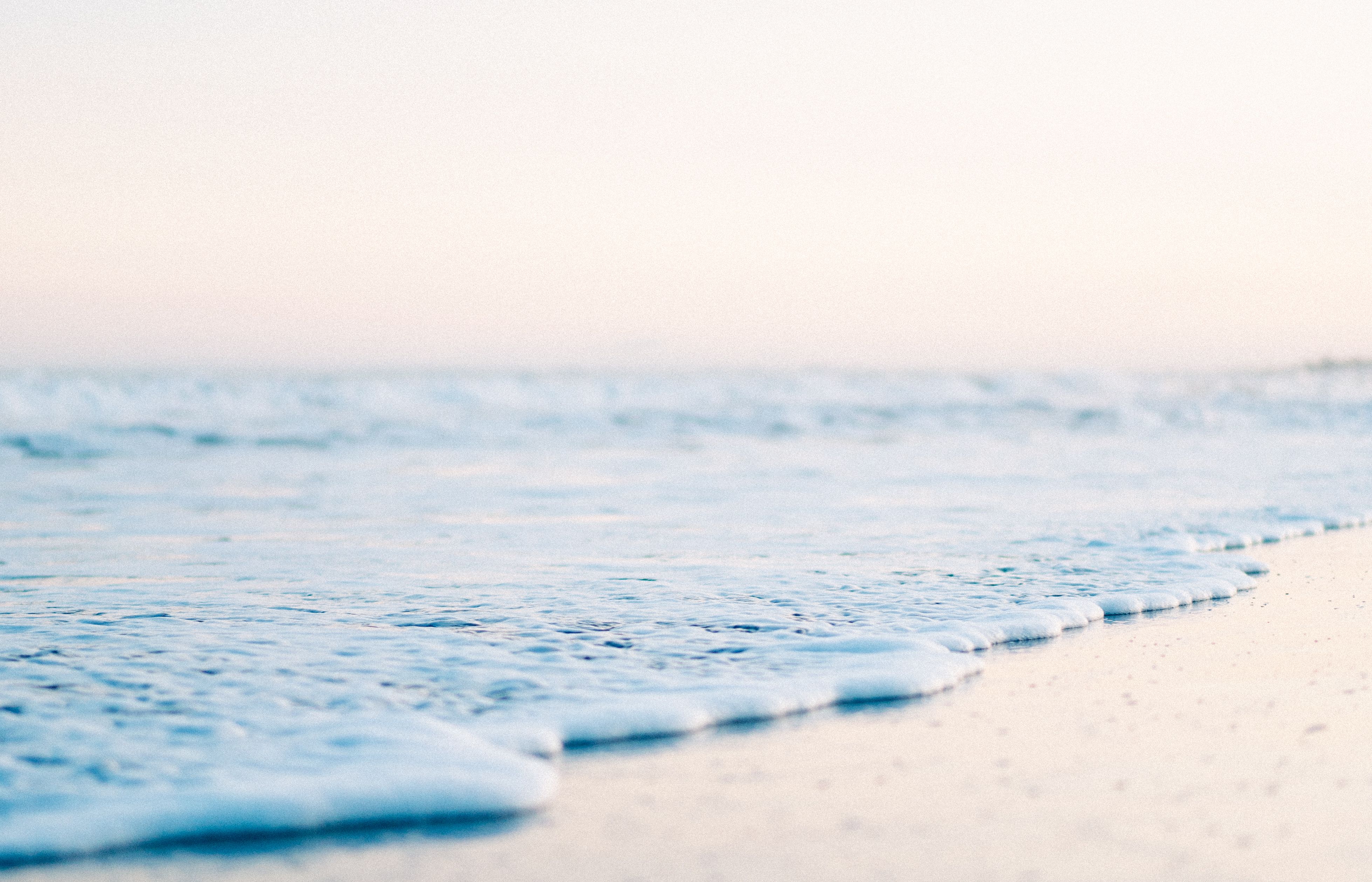 Low Angle Shot of a Beach and a Sea Wave · Free Stock Photo