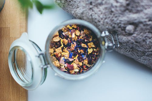 Selective Focus of Clear Glass Jar on White Surface