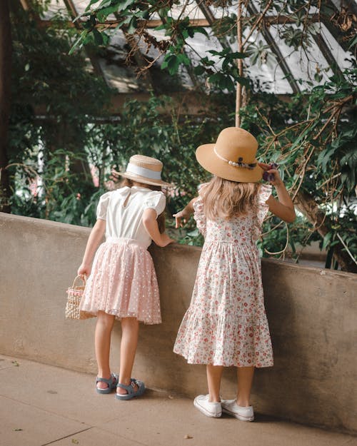 Girls Standing by Wall