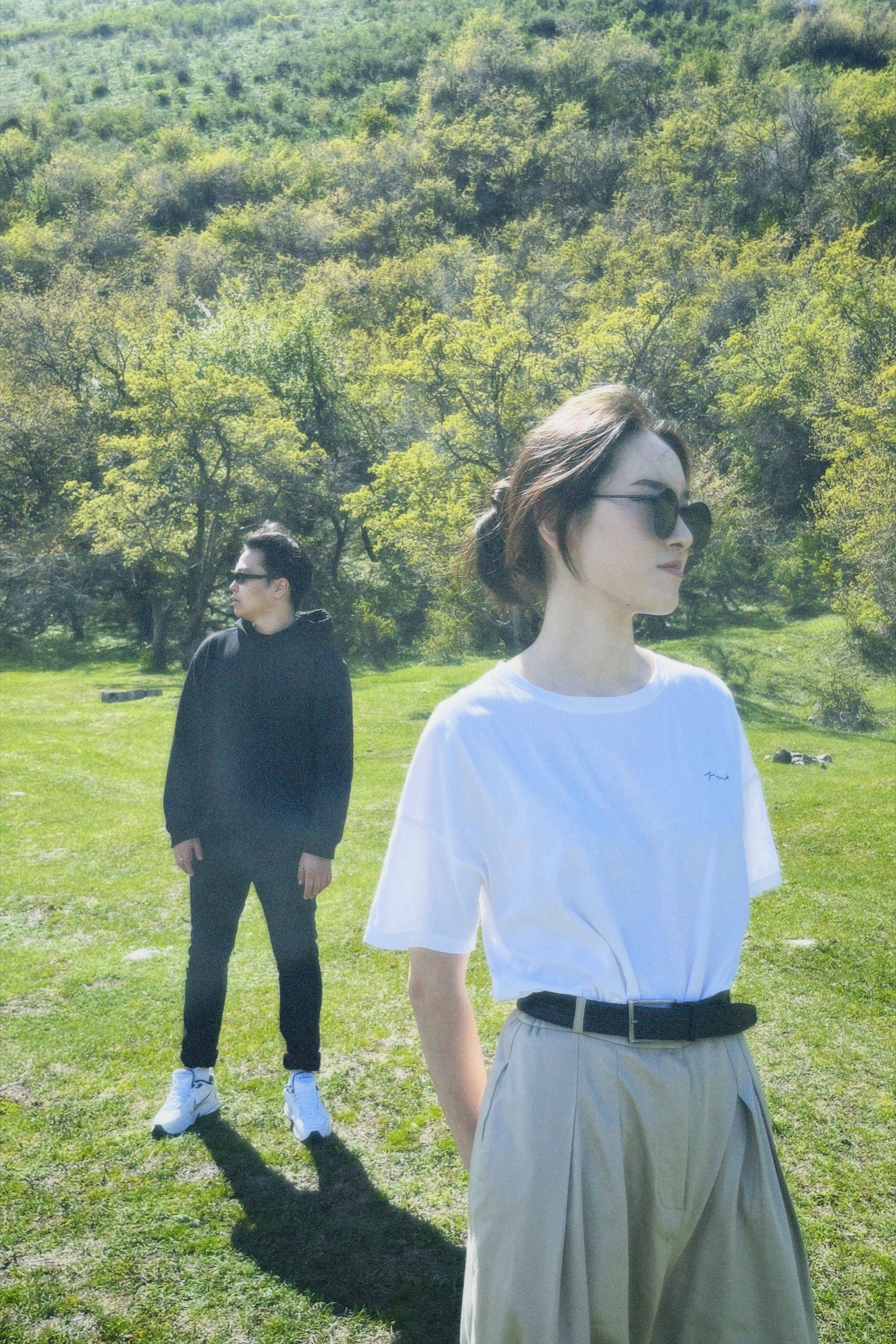 Photo of a Man and a Woman Standing in a Park · Free Stock Photo