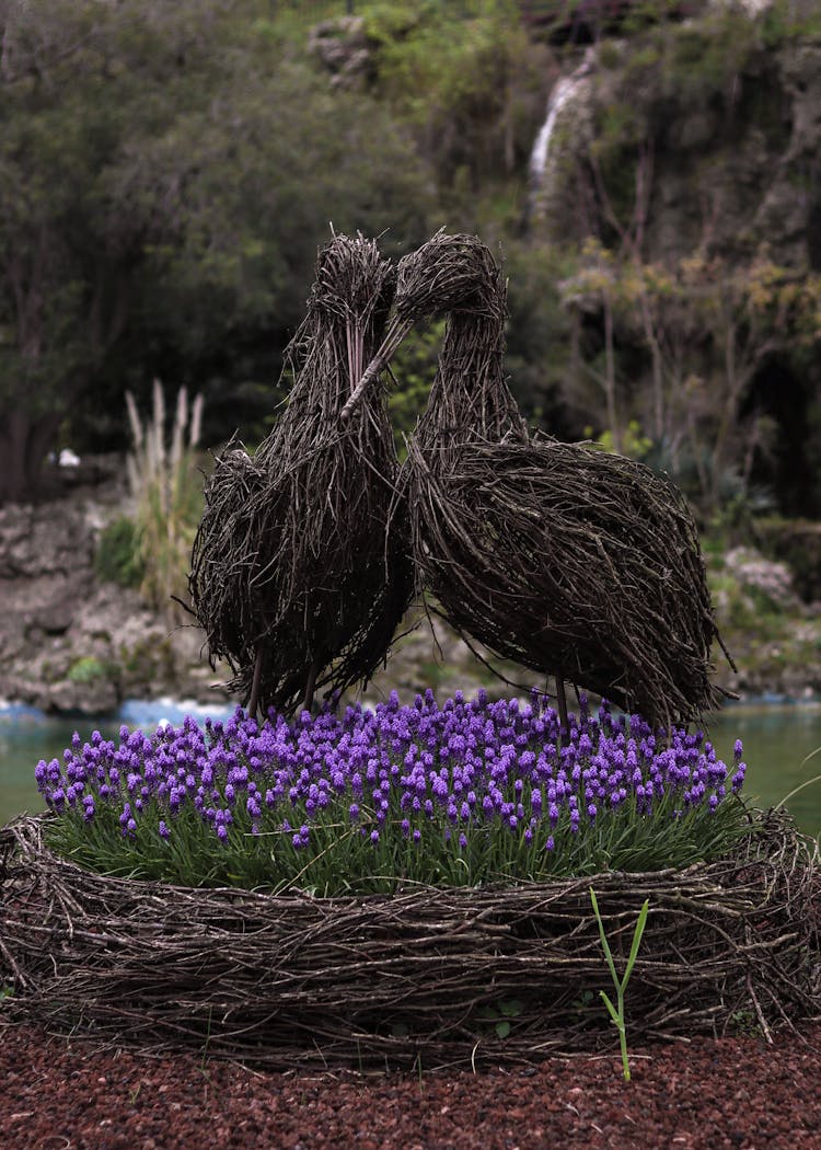 Flowers And Figurines Of Birds From Branches