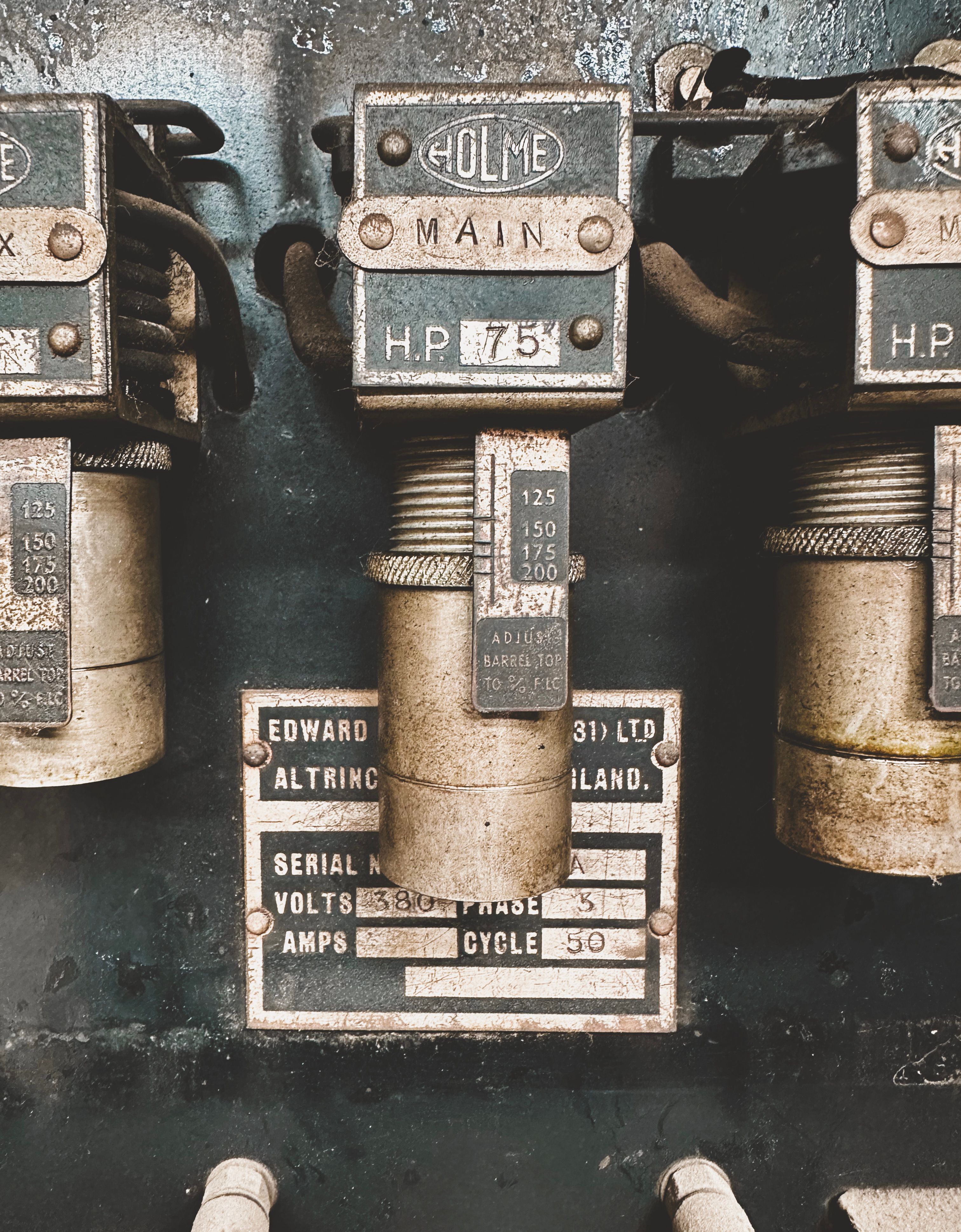 Detailed close-up of vintage industrial switches featuring labels, dials, and metal textures for retro design inspiration.