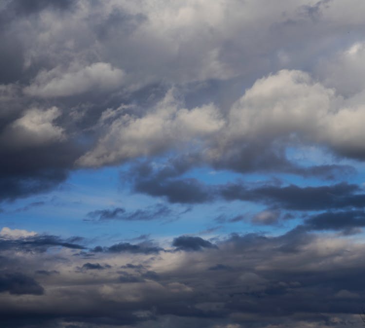 Stormy Grey Clouds In The Blue Sky