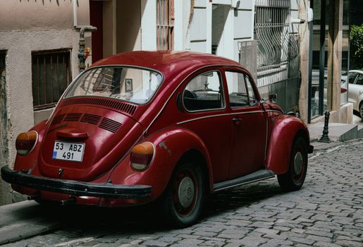 Claret Volkswagen Beetle Parked in the Street
