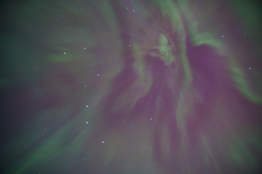 Vibrant aurora borealis creates breathtaking patterns in the night sky over Calgary.