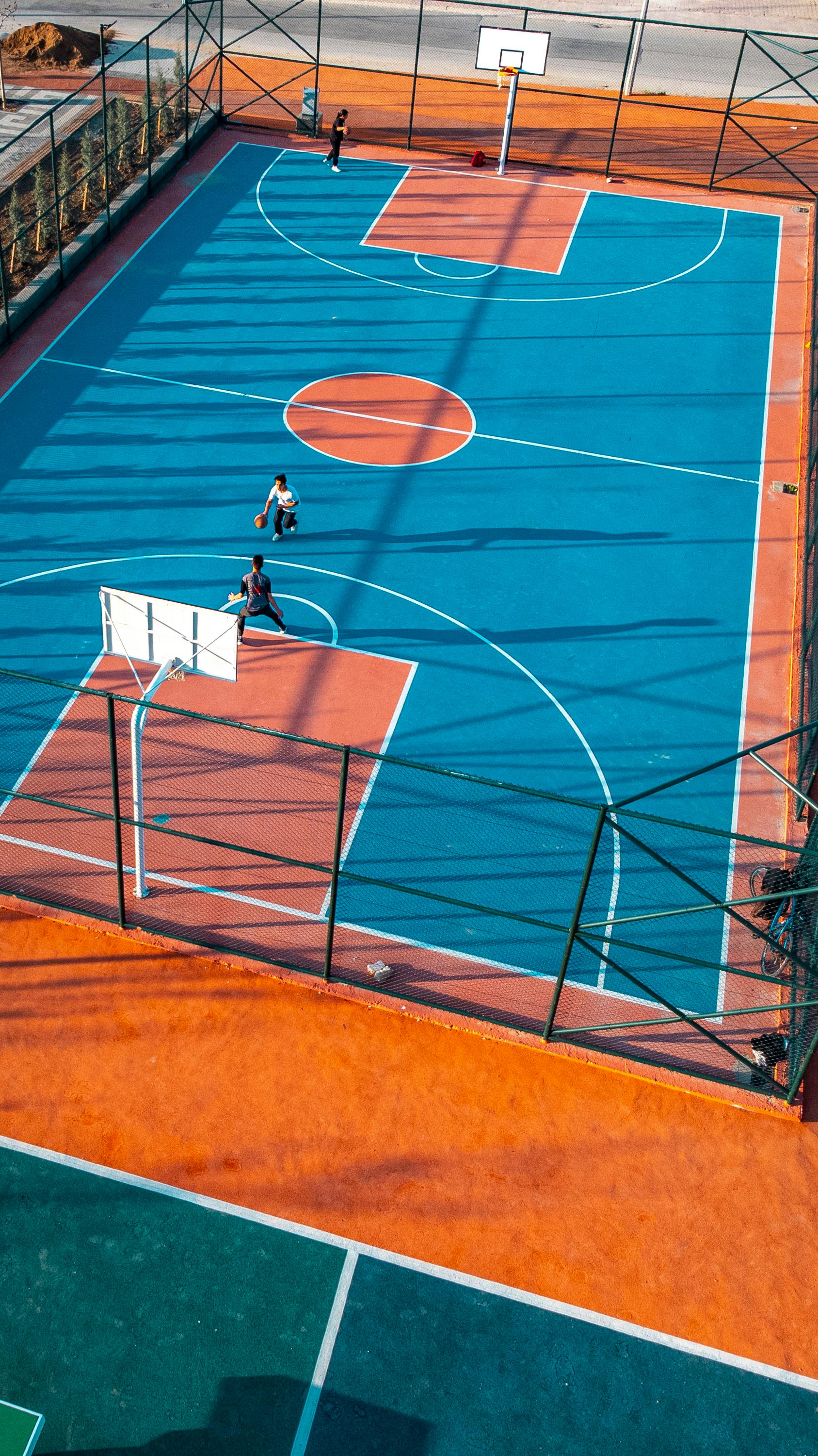 men playing basketball on a field