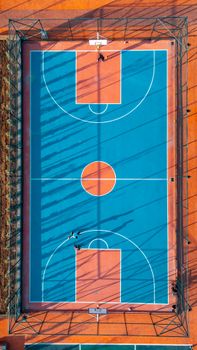 Explore an aerial view of a vibrant outdoor basketball court in Selçuklu, Konya, Türkiye.