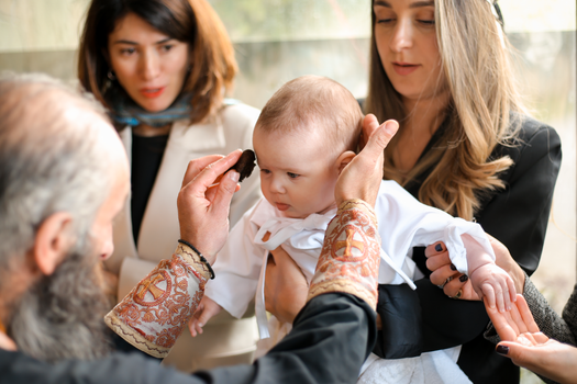 A Priest Baptizing a Baby