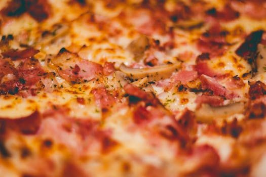 Mouth-watering close-up of pepperoni pizza with melted cheese and crispy crust.