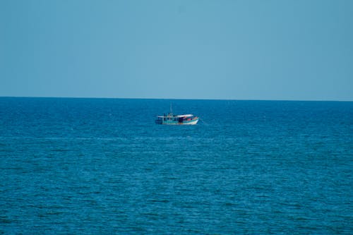 A Fishing Boat on an Open Sea 