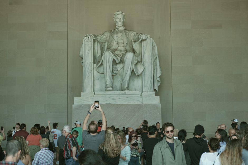 people cheering at National Mall
