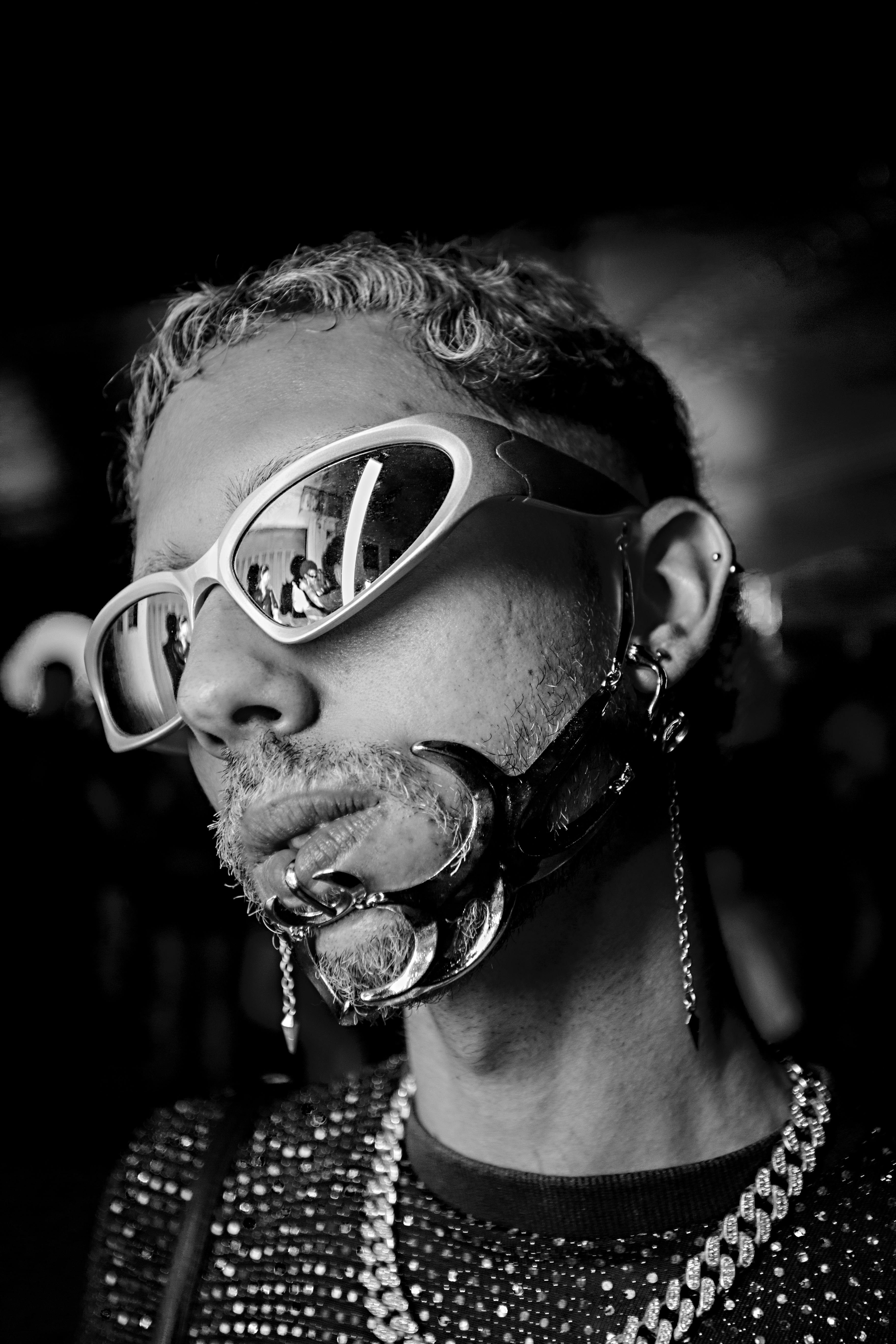 Black and white portrait of a man with sunglasses and metal jewelry, Brazil