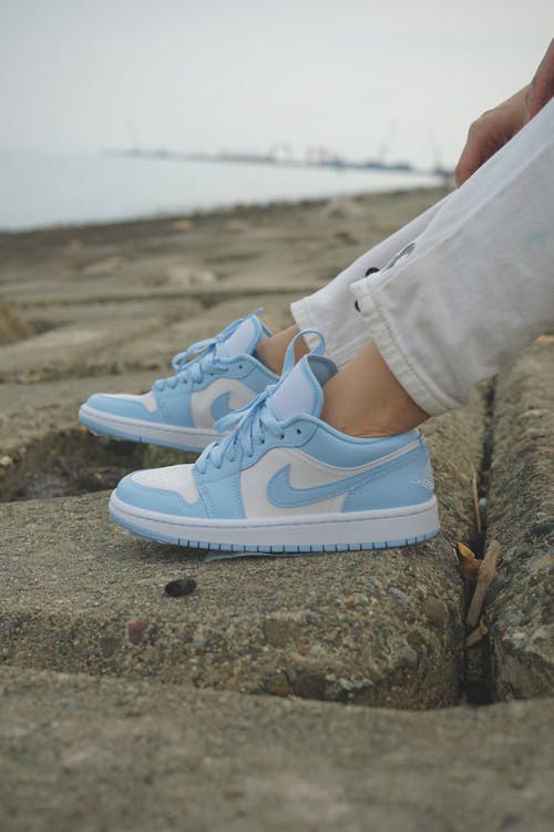 Blue and White Trainers on Rock