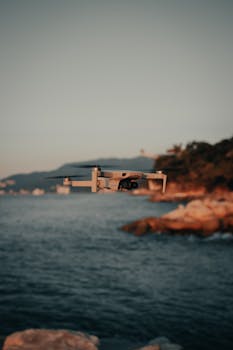 Drone capturing stunning coastal views in Puerto Vallarta during sunset.
