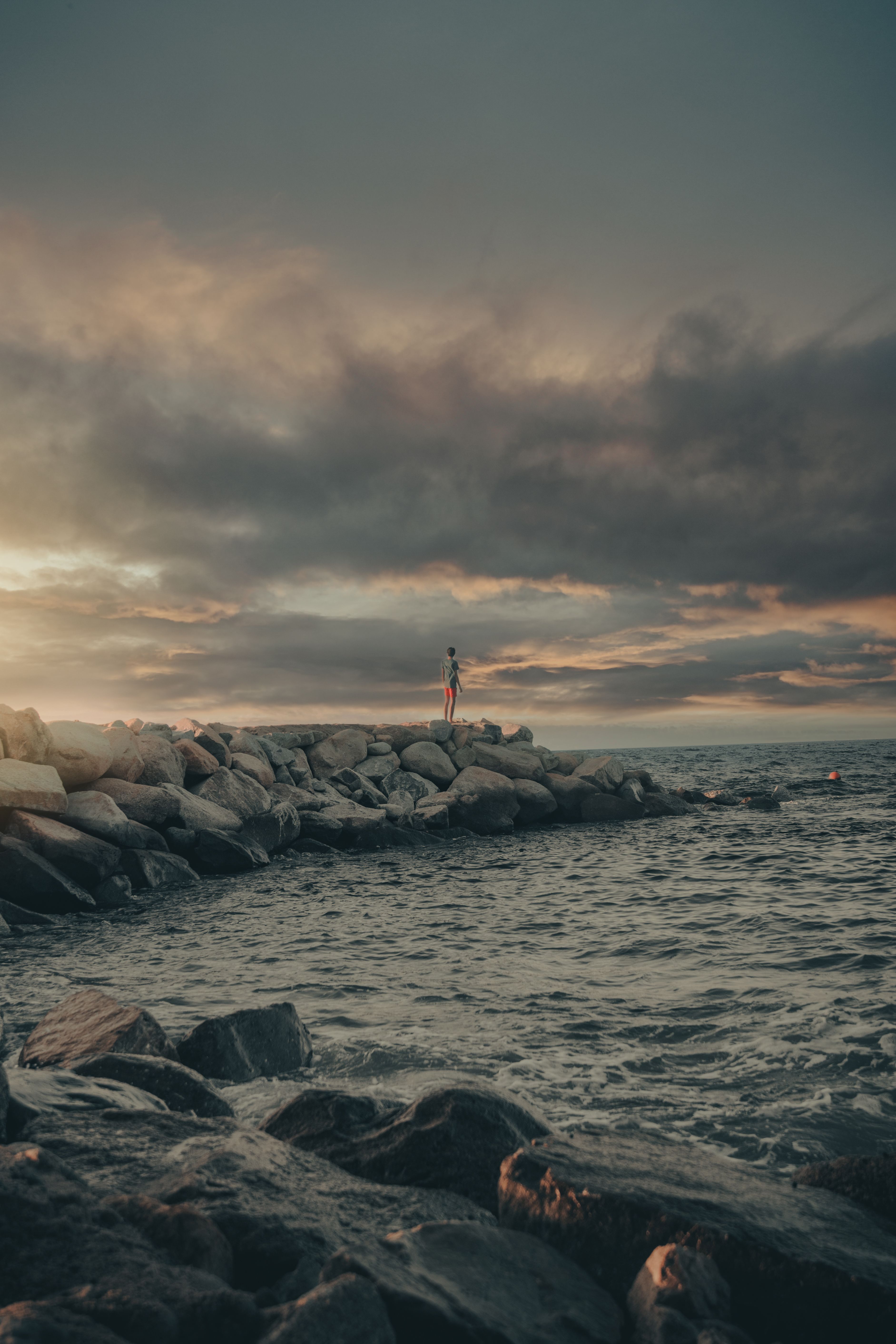A Rocky Shore at Sunset · Free Stock Photo