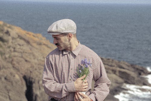 Man with Mustache in Shirt Posing with Flowers