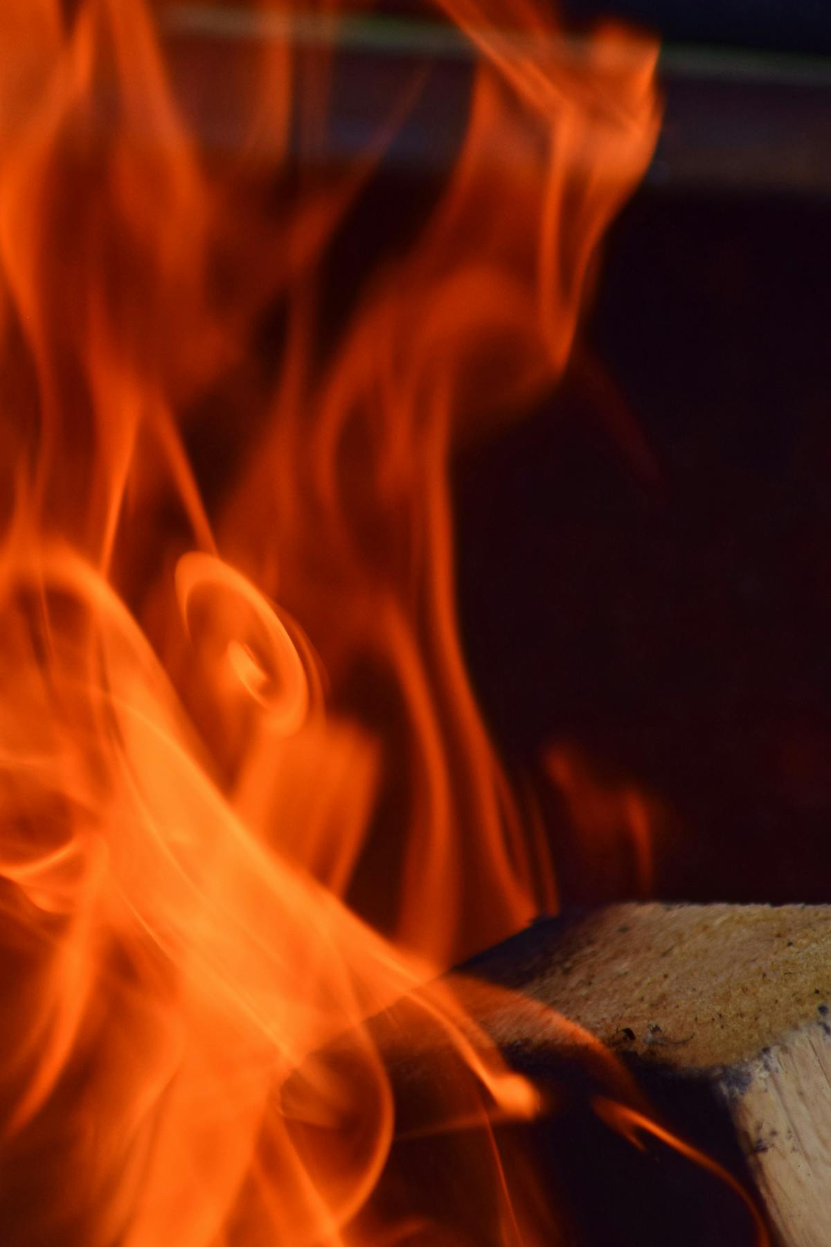 Emergency electrician in Laval working at night with flashlight on a sparking outlet in a residential home