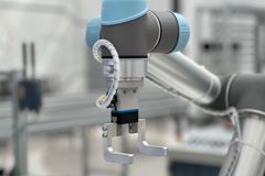 Close-up of a robotic arm in a modern industrial environment, highlighting technology.