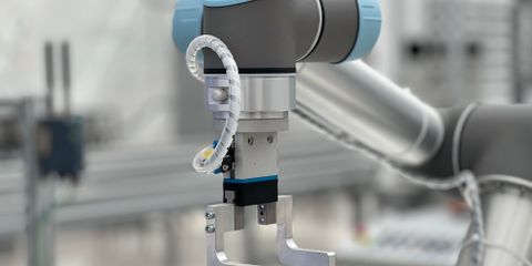 Close-up of a robotic arm in a modern industrial environment, highlighting technology.