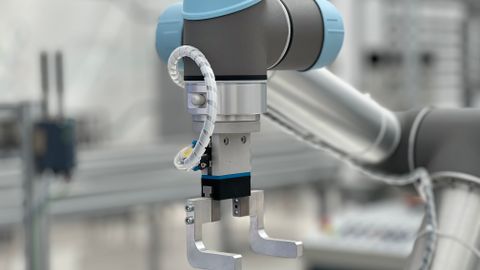 Close-up of a robotic arm in a modern industrial environment, highlighting technology.