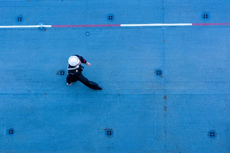 Sailor Walking On A Ships Deck