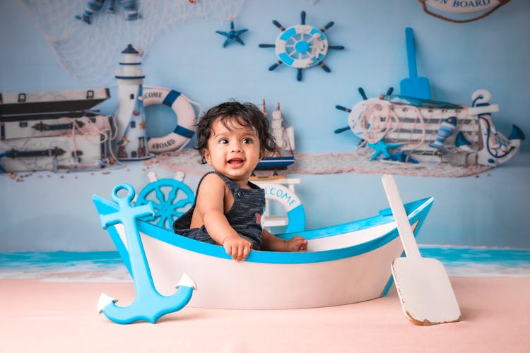 Baby Boy In Mockup Boat