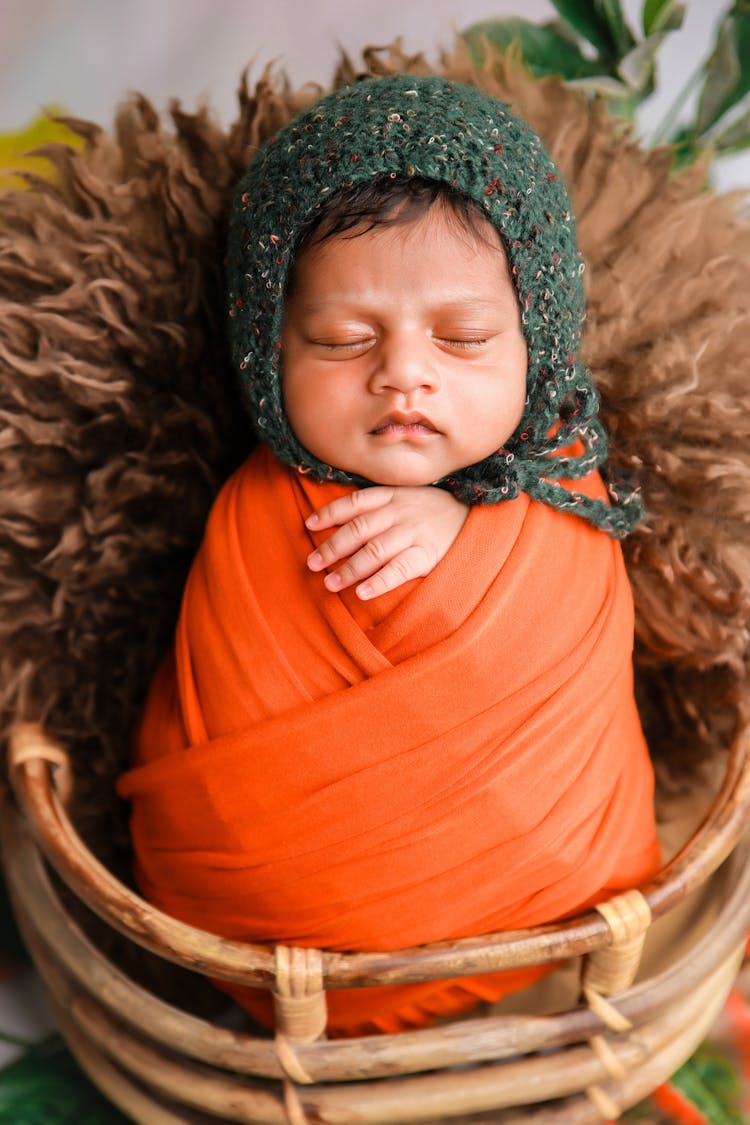 Cute Newborn Baby Lying In Basket