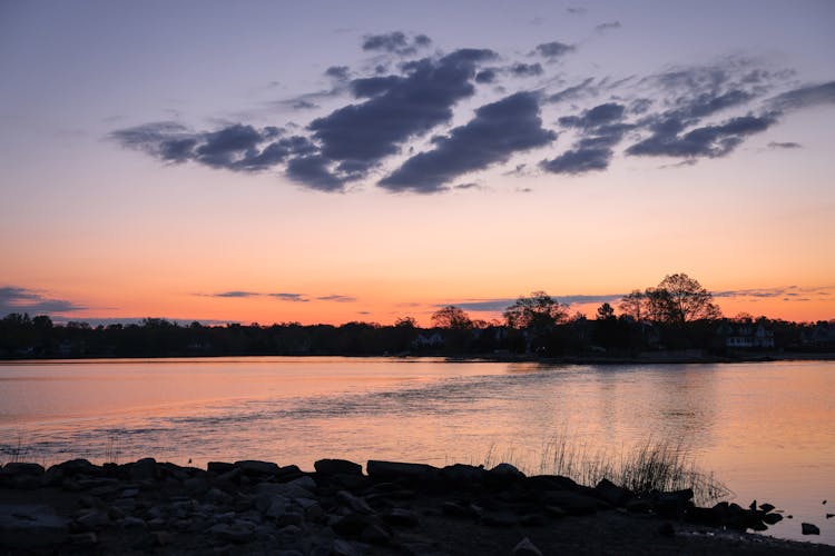 Lake In Countryside At Sunset