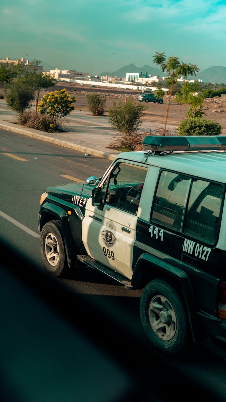 Police Car Driving On Road