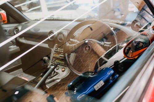 Interior of a Modern Car and Reflection of a Mazda MX-5 in the Window 