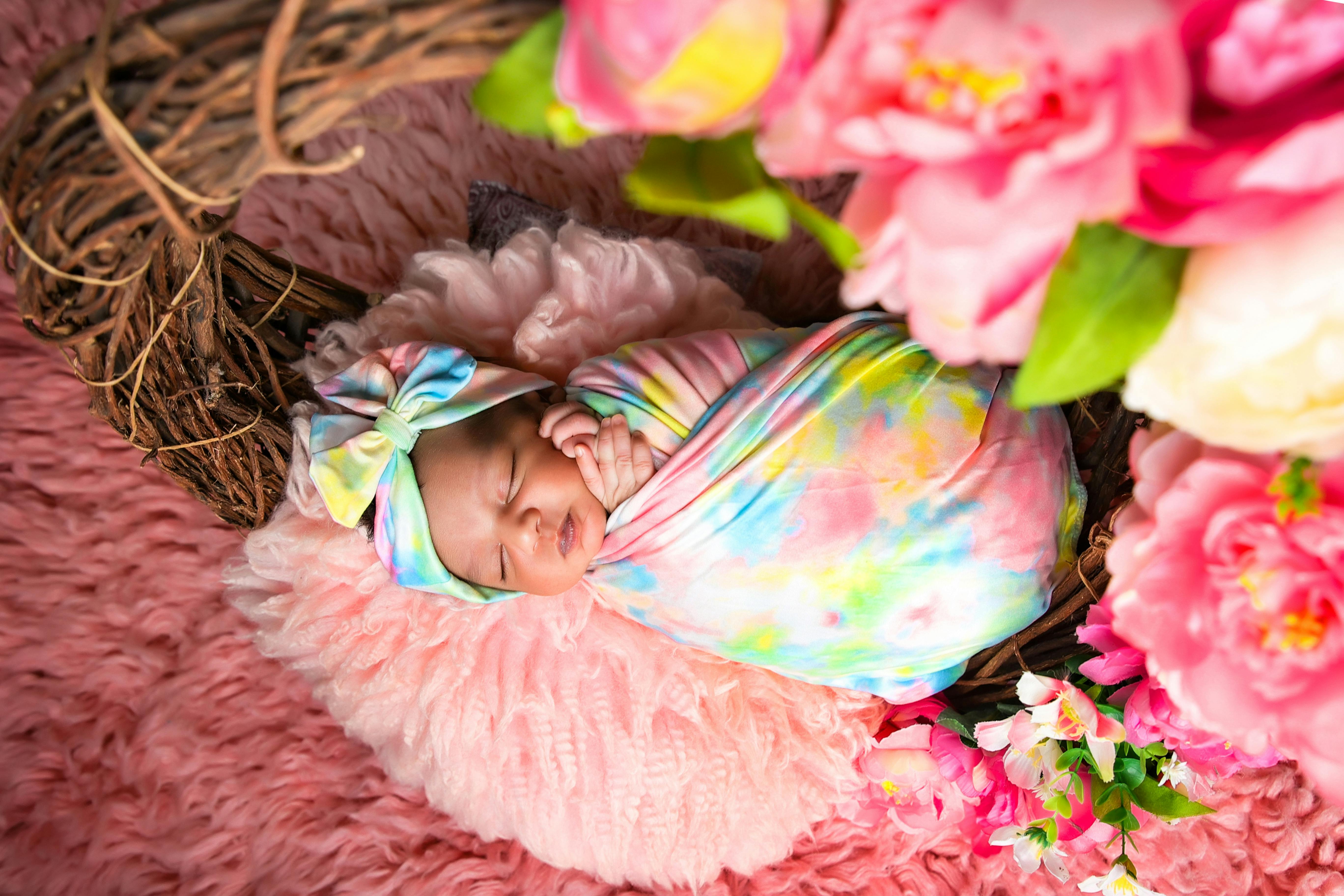 studio-shot-of-baby-sleeping-in-basket-free-stock-photo