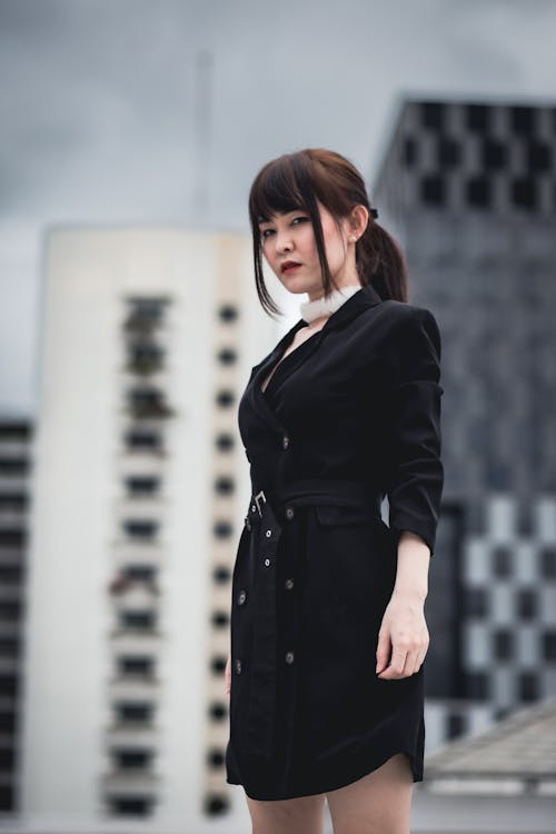 An Elegant Businesswoman in front of Buildings