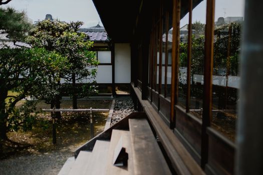 Elegant traditional Japanese architecture featuring wooden structures and serene garden views reflecting cultural heritage.