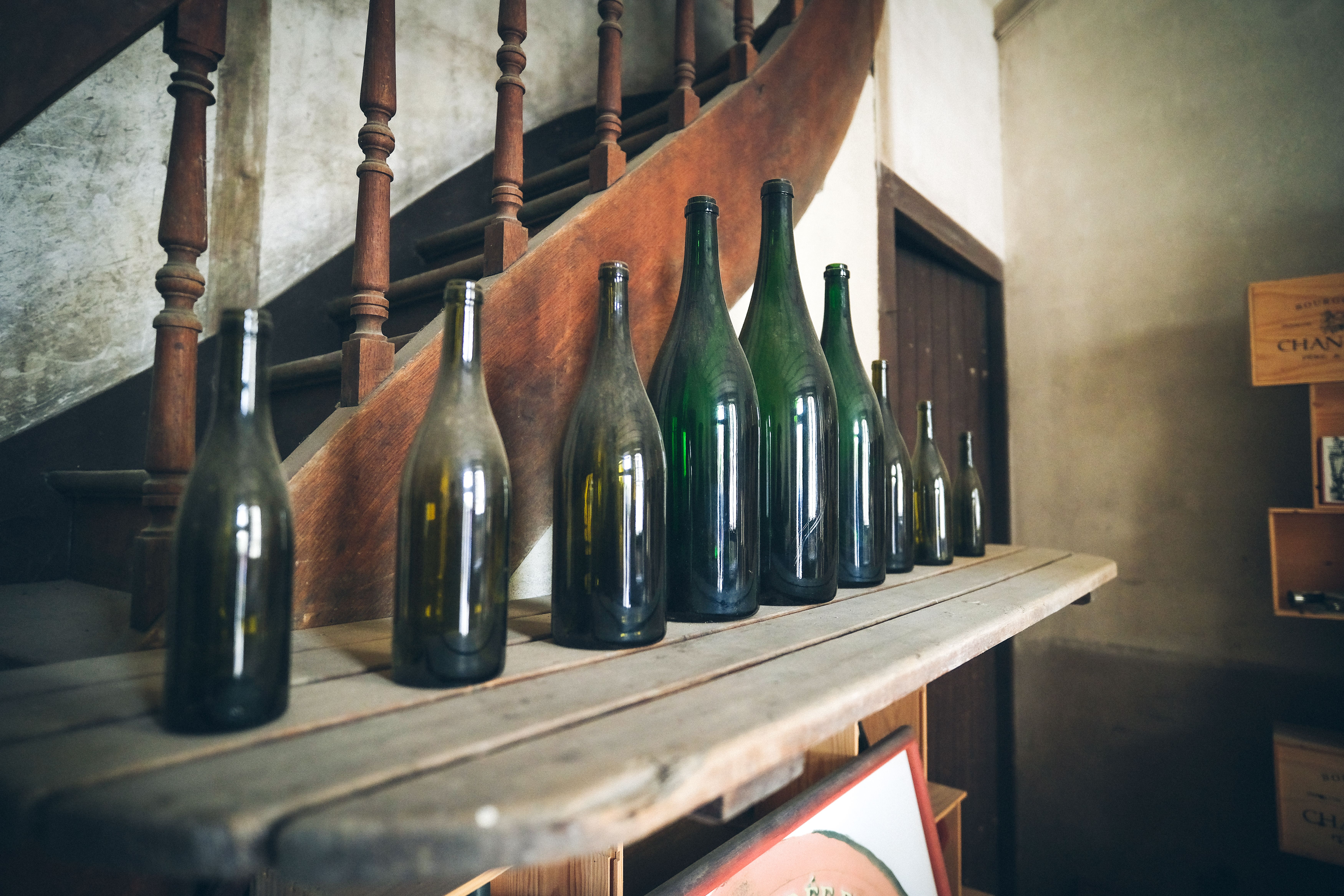 Old Wine Bottle on Wooden Shelf · Free Stock Photo