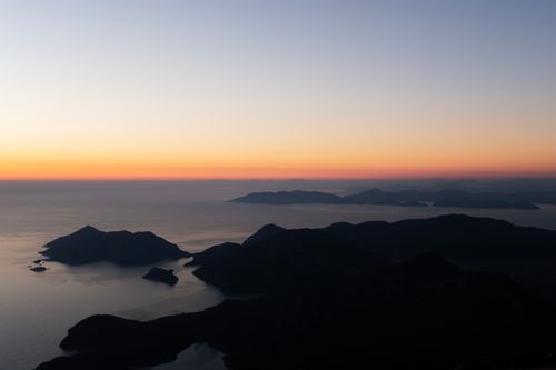 Free Stunning aerial view of Ölüdeniz, Türkiye, at sunset with vibrant colors over the sea. Stock Photo