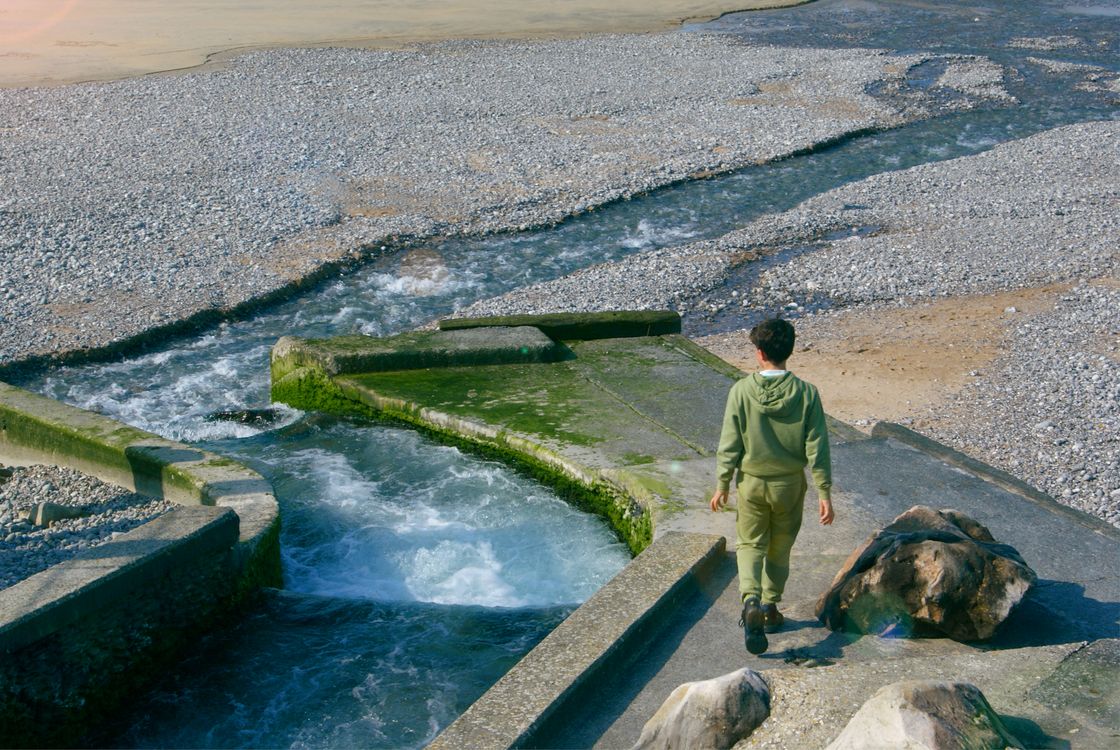 Walk Besides Stream Boy Walking near Stream on Beach · Free Stock Photo