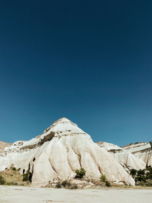 Explore the unique rock formations of Cappadocia, a natural wonder in Türkiye.