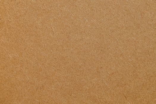 Detailed texture of a brown cardboard surface, ideal for backgrounds and design projects.