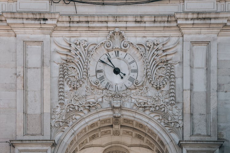 Clock On Rua Augusta Arch In Lisbon