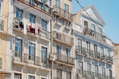 Lisbon townhouse facade with wrought-iron balconies, photo by Masood Aslami on Pexels
